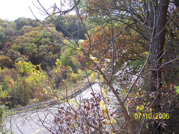 The view of modern U.S. 14 from the end of the old road, now a sheer cliff. The entrance to the scenic overlook is just visible in the lower left corner of the shot.