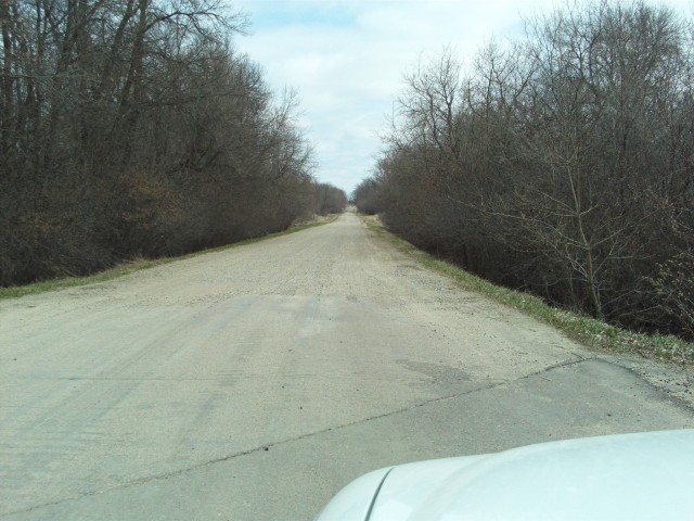 Looking east on Junction Avenue as it leaves Hawley, and the pavement gives way to gravel.