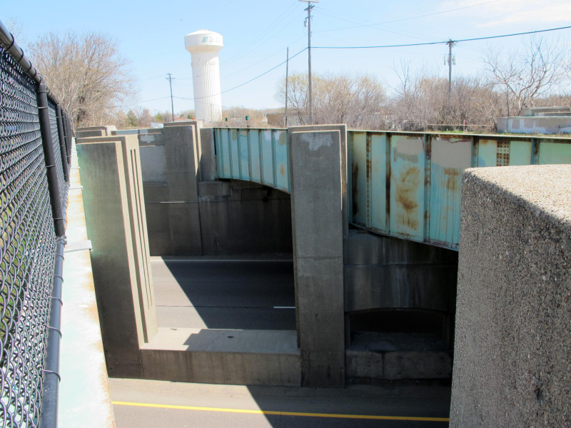 View between the old rail bridges over Hwy 100, looking southeast.